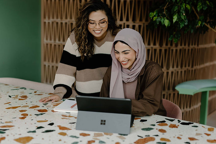 A hijabi Muslim woman with an Asian BIPOC woman looking for a virtual BIPOC therapist in Ottawa