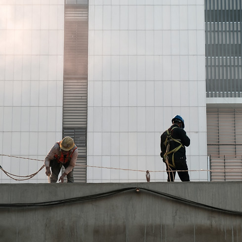 Rescue team with safety gear work a top a building