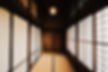 Serene traditional Japanese interior hallway with tatami mats and shoji screens. Experience authentic Japanese design on a private, curated Tokyo luxury tour.