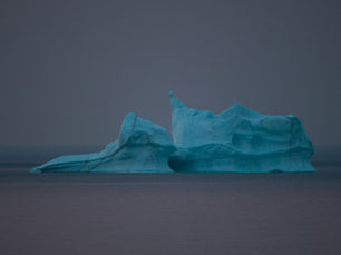 A picture of an iceberg, representing how the features of a SaaS product are visible to users, while the functionalities are hidden behind the UI.