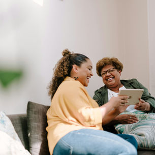Adult daughter talking with elderly mother about starting an exercise program