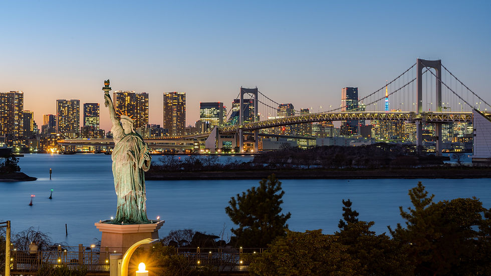 The statue of Liberty and Rainbow bridge near Tokyo cruise terminal is in Odaiba in the eastern side of Tokyo Bay.