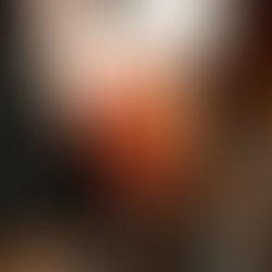 A Someone is being handed a pink cocktail with a curled lemon strip, as if from a bartender