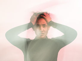 Person experiencing an overstimulated Nervous System in Dubai seeking support at Retrieve Mind Poly Clinic.