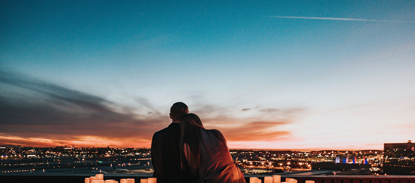 Couple watching the sunset together – representing love, connection, and shared presence.