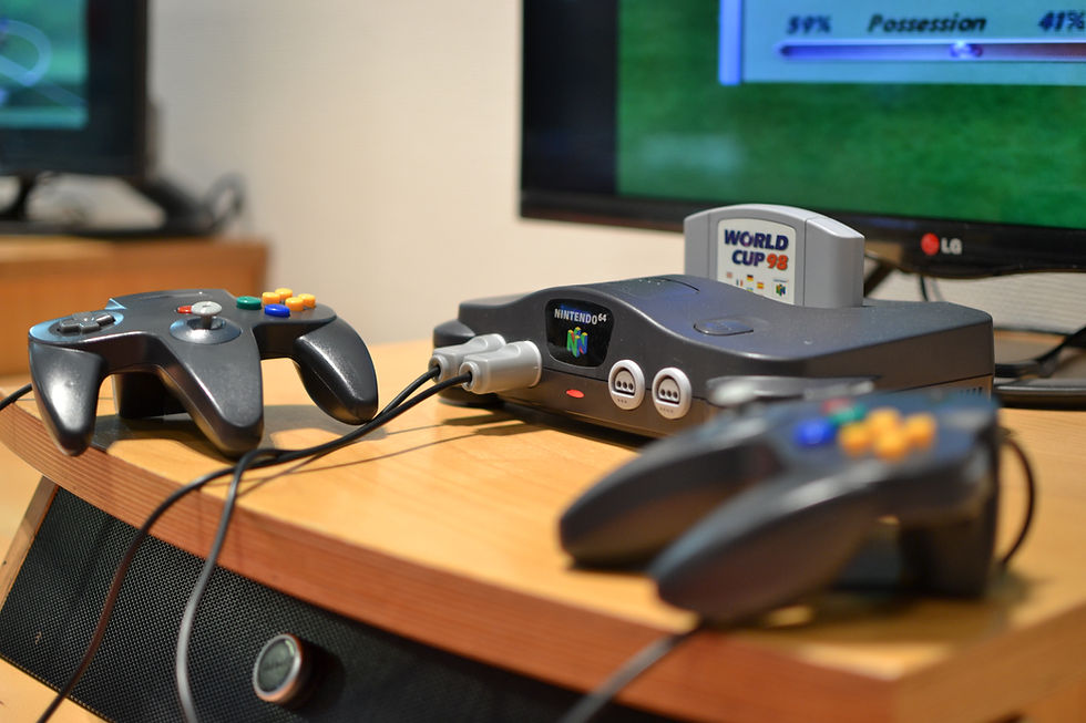 A Nintendo 64 with World Cup 98 game cartridge.