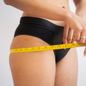 Woman measuring her body composition - Health Weight Week