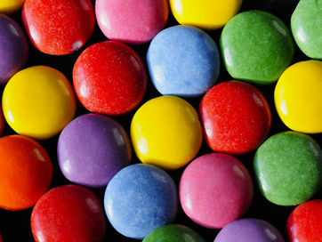 Colorful candies representing sugar cravings, sugar dependence and the challenges of managing suggar addiction during recovery