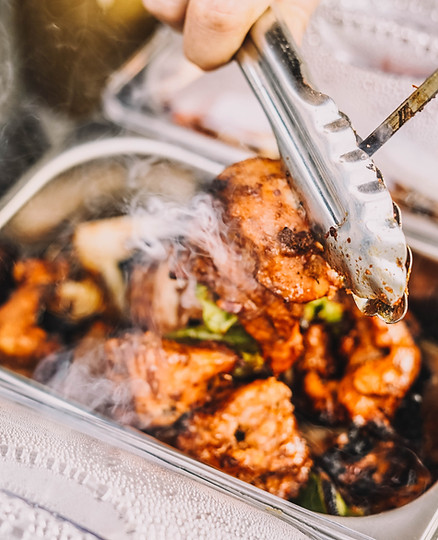 Hot food being handed out by catering staff
