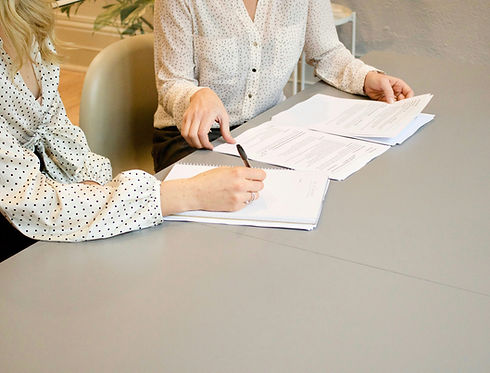 Contract signing with polka dot blouses