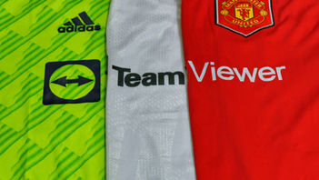 Three Manchester United football shirts in neon green, white, and red, showing Adidas and TeamViewer sponsor logos side by side.