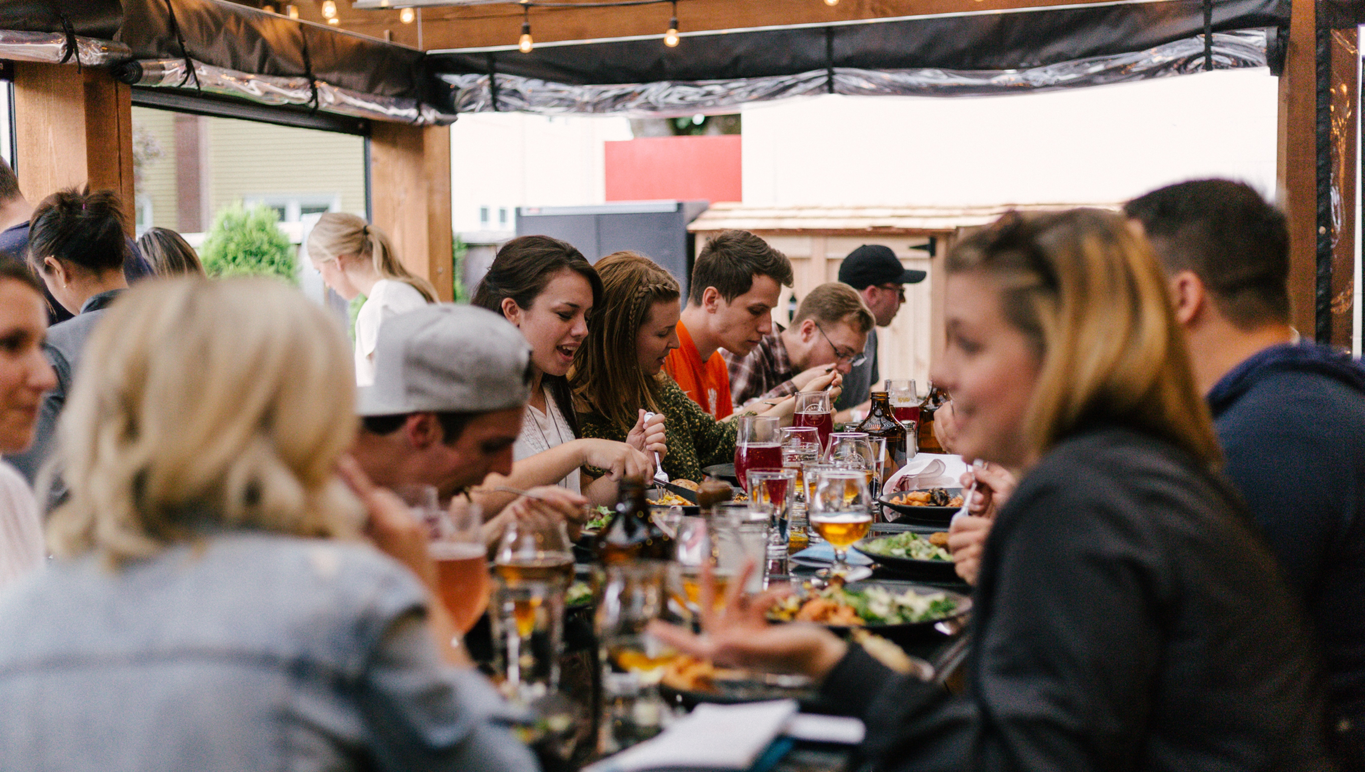 Restaurant guests gathering at a table.