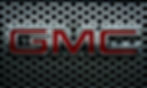 GMC mechanic performing wheel alignment and suspension repair