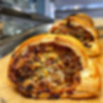Pork, wild garlic & mature cheddar sausage roll