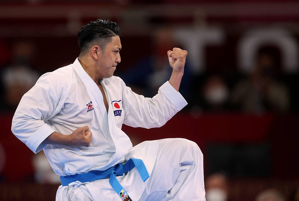 A karateka shows intense focus while blocking